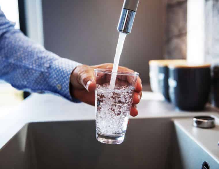 Man Pouring Himself Water