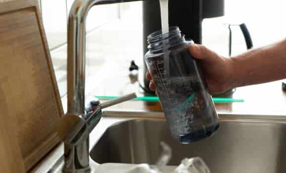 Filling sport water bottle