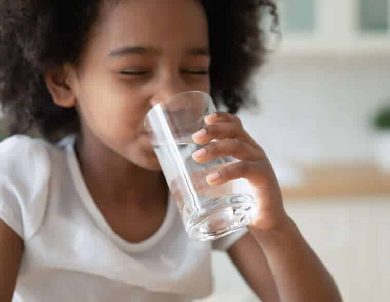 Little girl drink pure mineral water