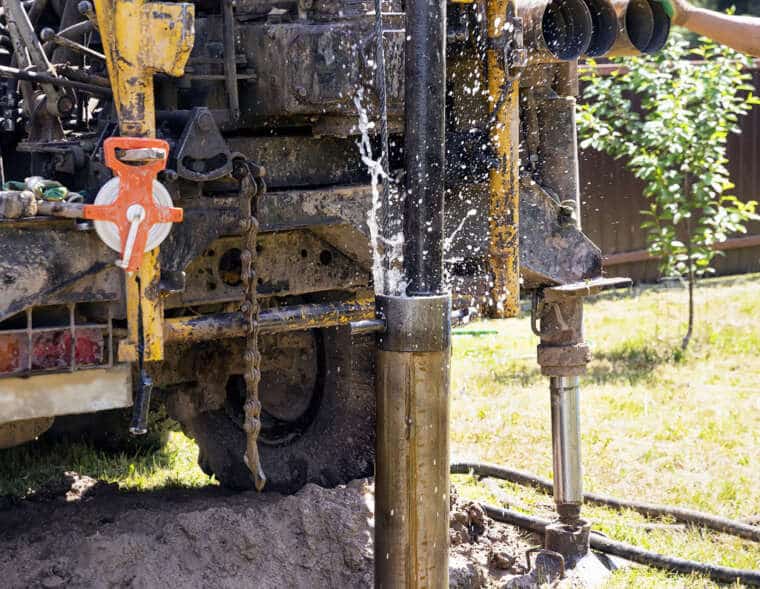 Drilling rig, drill pipe lifting. Water comes from the pipes. Strength and energy