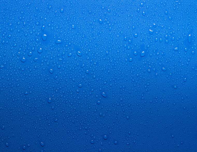 Water drops on a blue surface