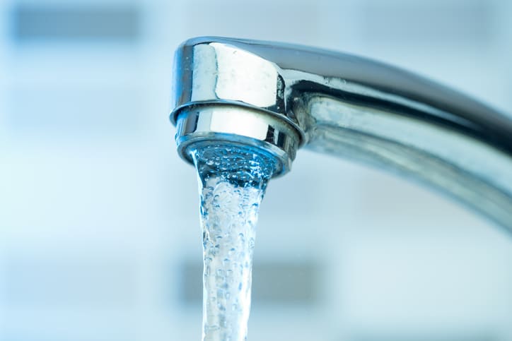 Pouring water from a Faucet high quality and high resolution studio