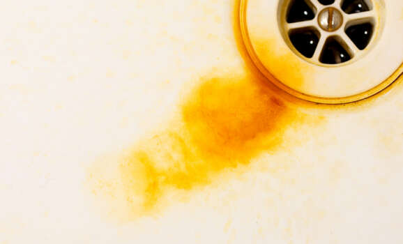 Rust in the sink from dirty water.